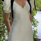 Robe de soirée longue blanche à col en V et nœud noir à manches courtes et coupe ajustée nv2047