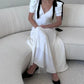 Robe de soirée longue blanche à col en V et nœud noir à manches courtes et coupe ajustée nv2047
