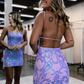 Glitzerndes, rückenfreies, kurzes Homecoming-Kleid mit lila Pailletten, nv1249